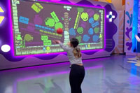 girl plays multiball game system